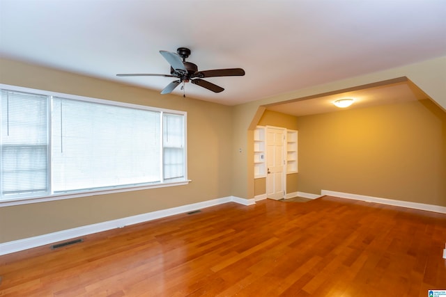 empty room with wood-type flooring and ceiling fan