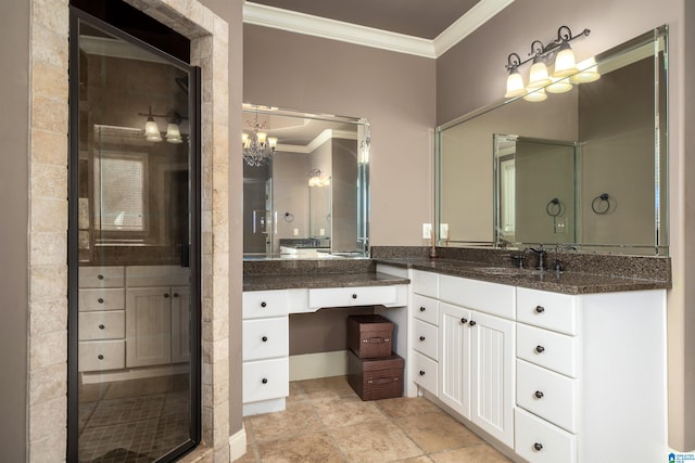 bathroom featuring vanity, ornamental molding, and a chandelier