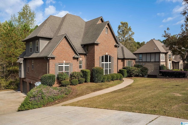 view of property exterior featuring a yard and a garage