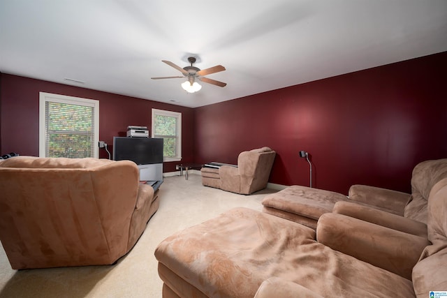 living room featuring ceiling fan and light colored carpet