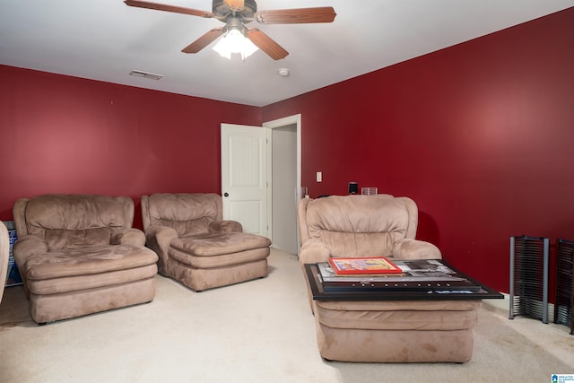 living room with carpet and ceiling fan