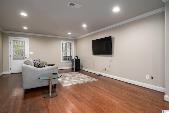 living room featuring crown molding and dark hardwood / wood-style flooring