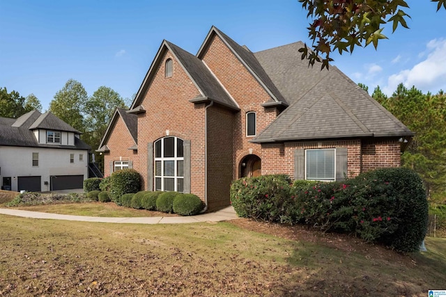 front facade with a front lawn