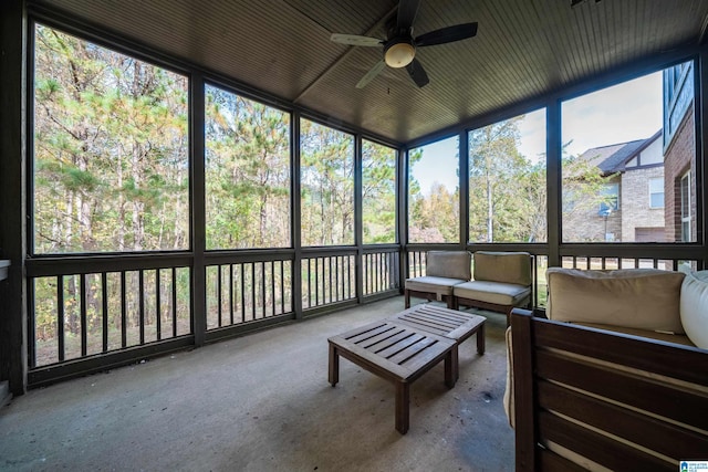 sunroom / solarium featuring ceiling fan