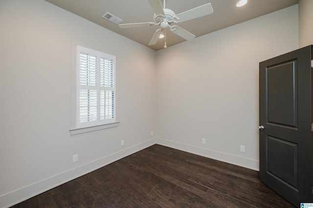 empty room featuring ceiling fan and dark hardwood / wood-style flooring