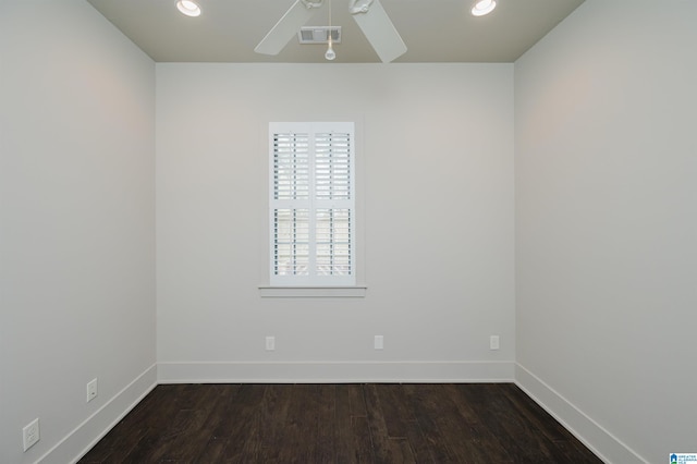 unfurnished room with ceiling fan and dark hardwood / wood-style flooring