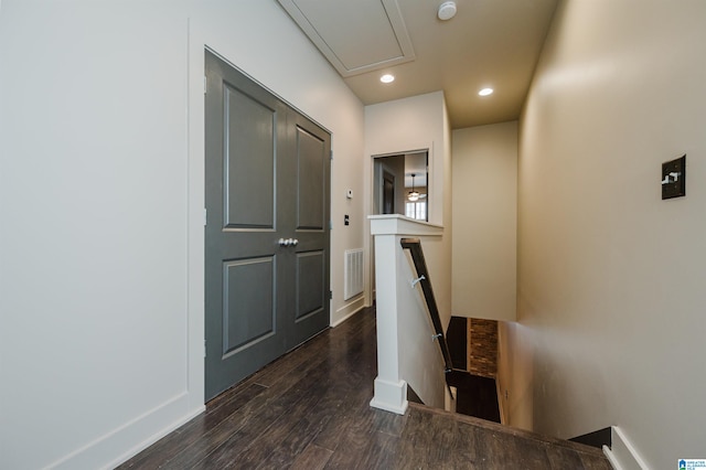 corridor featuring dark hardwood / wood-style flooring