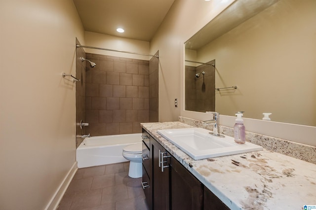 full bathroom with tiled shower / bath, vanity, toilet, and tile patterned flooring