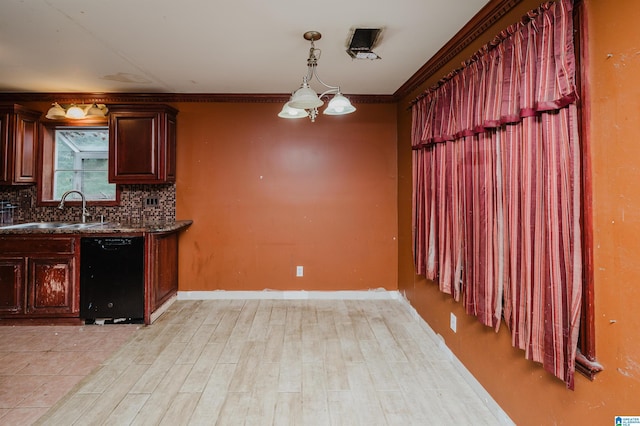 kitchen with black dishwasher, a sink, tasteful backsplash, light wood finished floors, and dark countertops