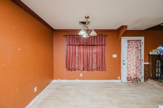 unfurnished room featuring ornamental molding