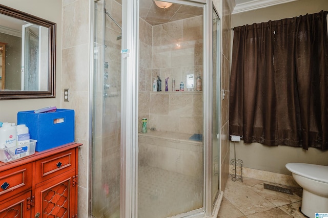 full bath featuring toilet, a shower stall, and crown molding