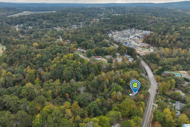 view of property location featuring a heavily wooded area