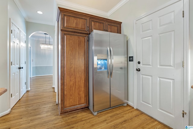 kitchen with stainless steel refrigerator with ice dispenser, light hardwood / wood-style flooring, and crown molding