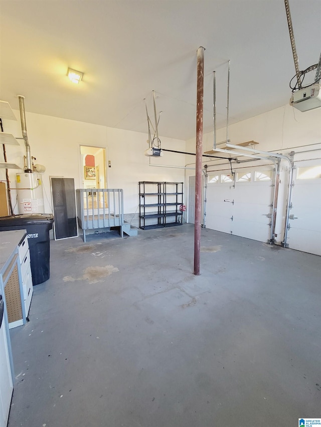 garage featuring a garage door opener and water heater