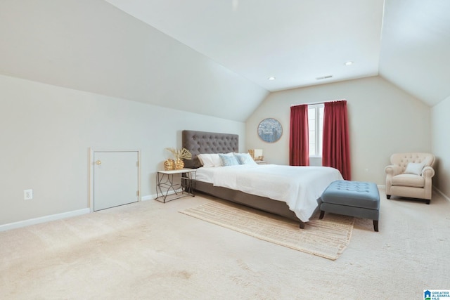 carpeted bedroom featuring vaulted ceiling, visible vents, and baseboards