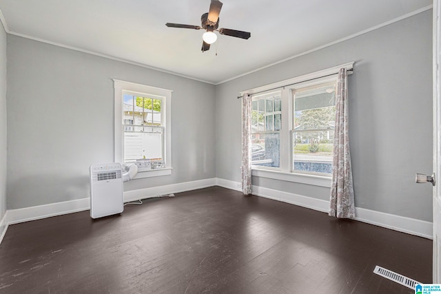 spare room featuring ceiling fan, crown molding, and dark hardwood / wood-style flooring