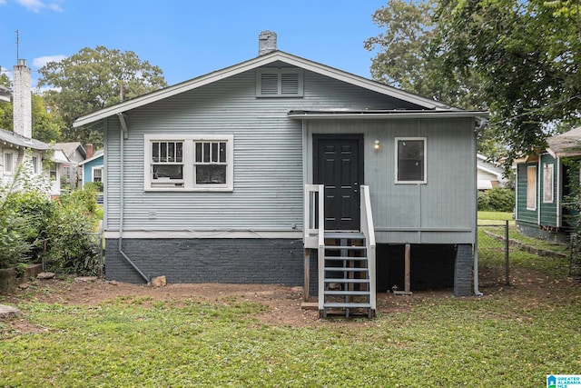 view of front of home with a front lawn