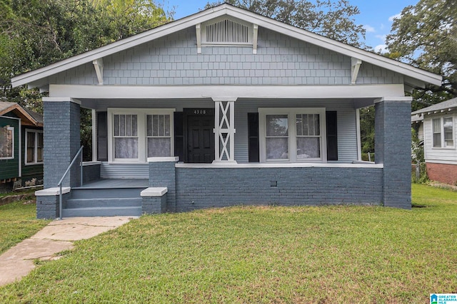 bungalow-style home featuring a front yard and a porch