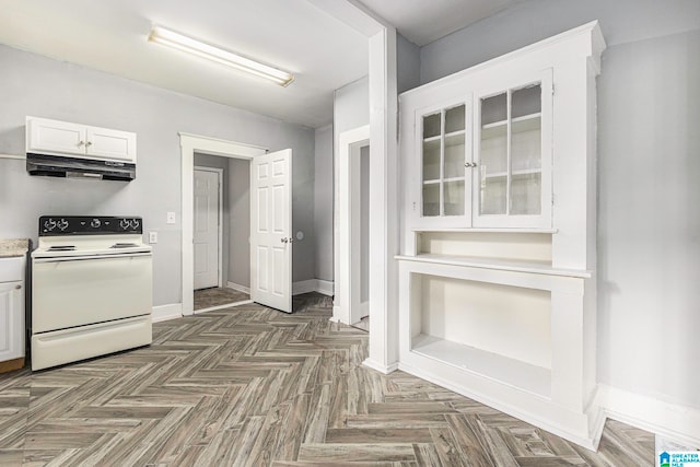 kitchen with white cabinets, white electric range, and dark parquet floors