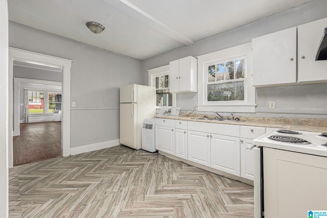 kitchen with sink, electric range, white refrigerator, and white cabinets