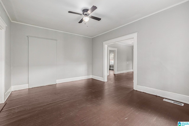 unfurnished room with crown molding, ceiling fan, and dark hardwood / wood-style flooring