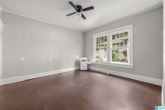 spare room with dark wood-type flooring, crown molding, a textured ceiling, and ceiling fan