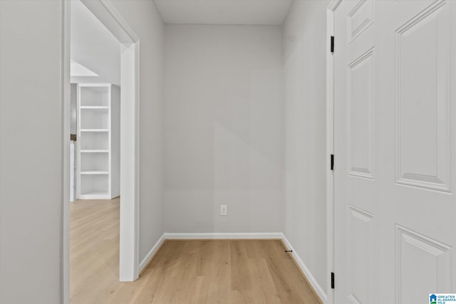 corridor with light wood-type flooring