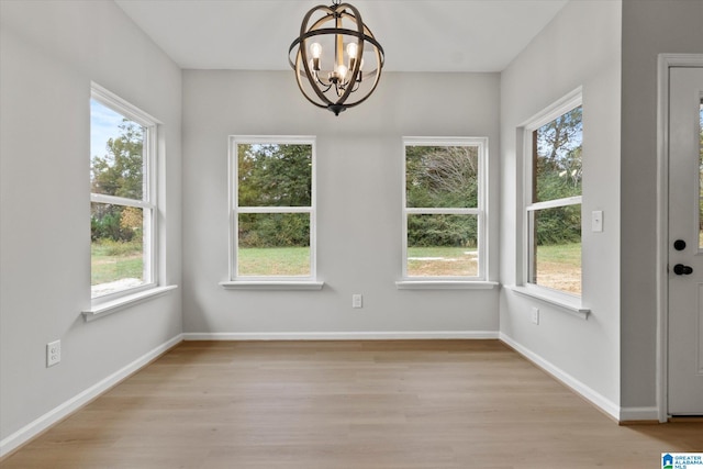 interior space featuring a wealth of natural light and an inviting chandelier