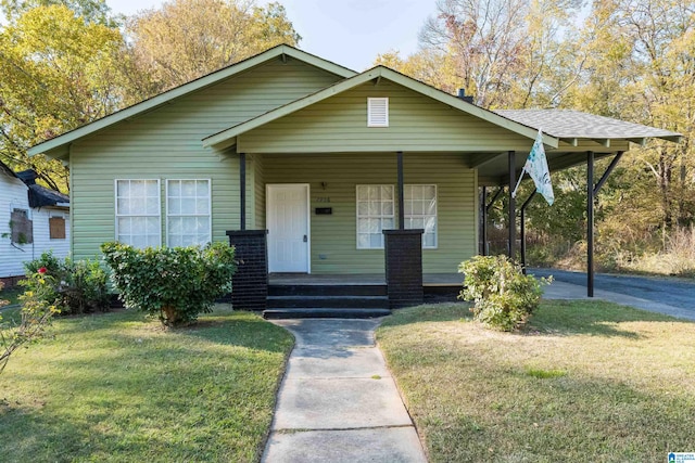 bungalow-style house with a front yard