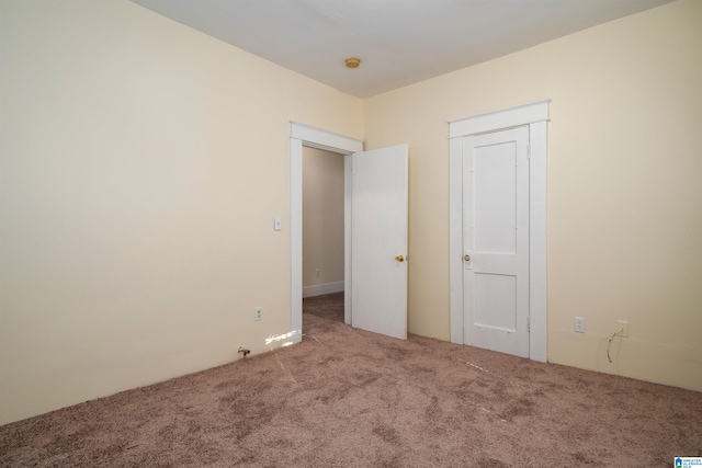 unfurnished bedroom featuring carpet