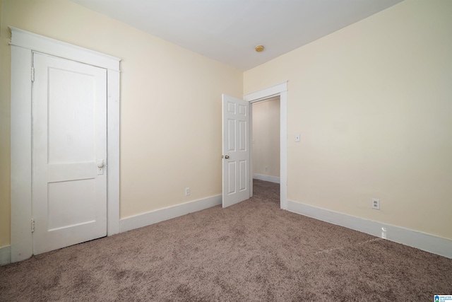 empty room featuring carpet floors