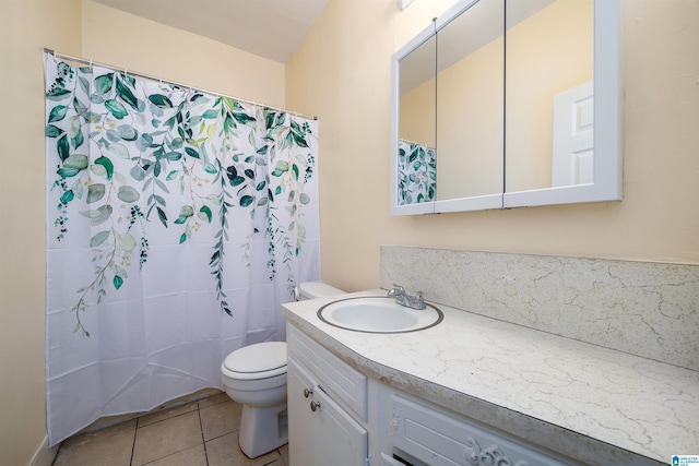 bathroom with toilet, walk in shower, vanity, and tile patterned flooring