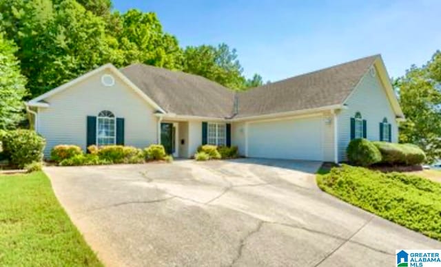 ranch-style house featuring a garage