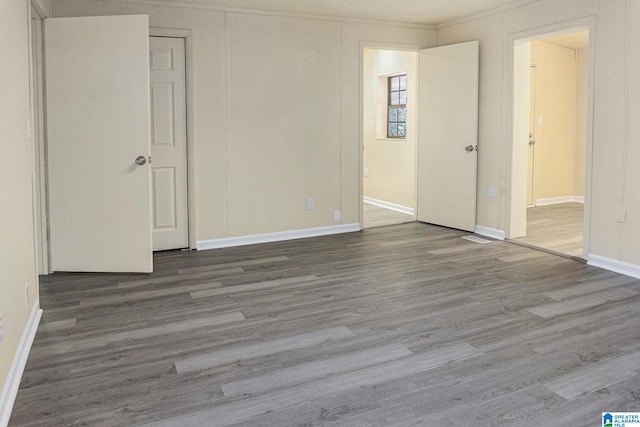 empty room with hardwood / wood-style flooring