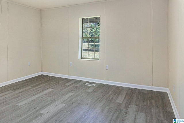 unfurnished room featuring hardwood / wood-style flooring