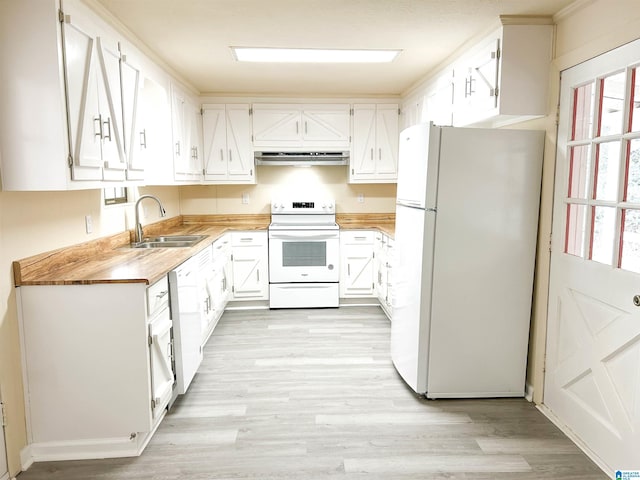 kitchen featuring white appliances, white cabinetry, and sink