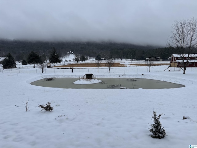 yard covered in snow featuring a playground