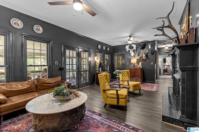 living room with french doors, ceiling fan, and dark hardwood / wood-style floors