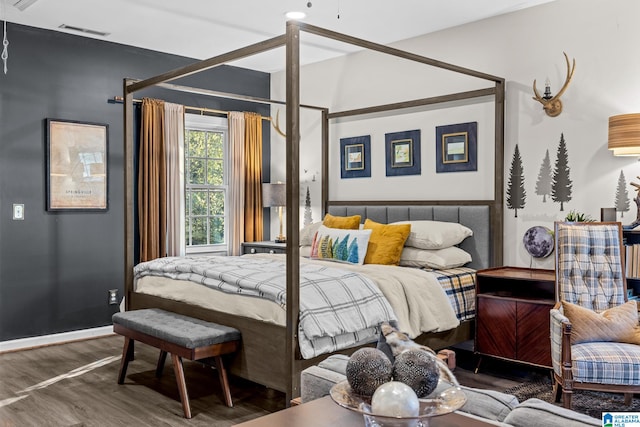 bedroom featuring dark hardwood / wood-style floors