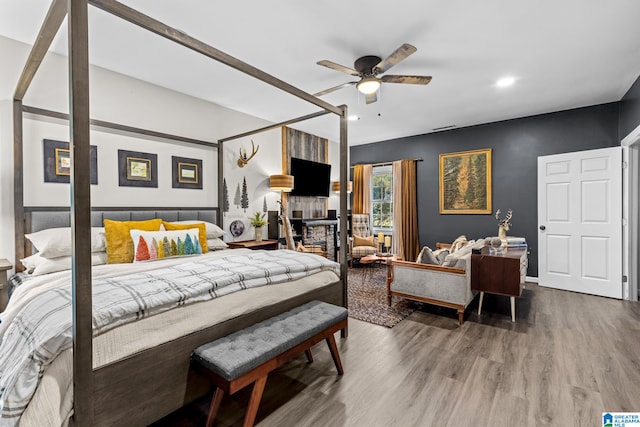 bedroom with wood-type flooring and ceiling fan