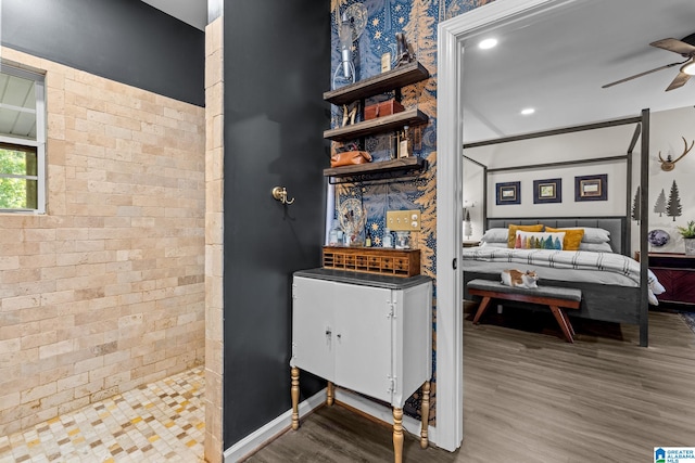 interior space with ceiling fan and hardwood / wood-style floors