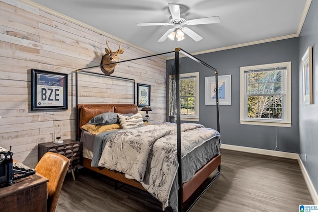 bedroom featuring dark wood-type flooring, wood walls, ceiling fan, and crown molding