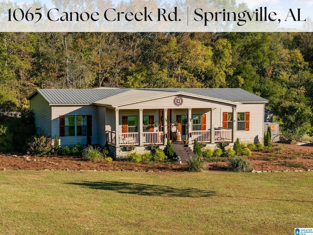 ranch-style home with a porch and a front lawn