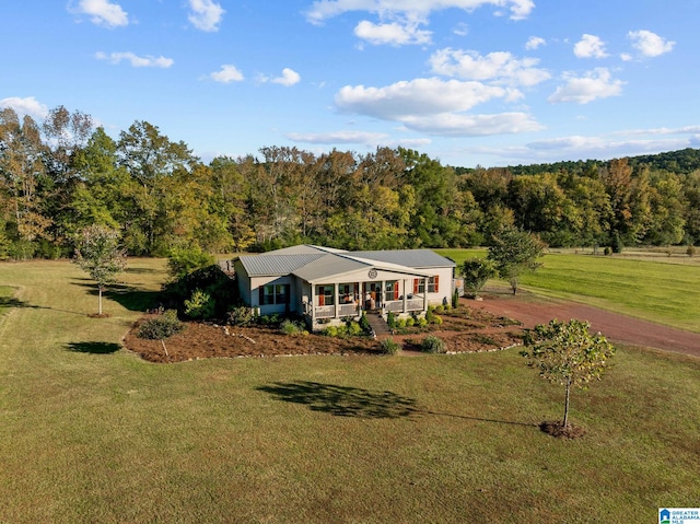 view of front of house featuring covered porch and a front yard