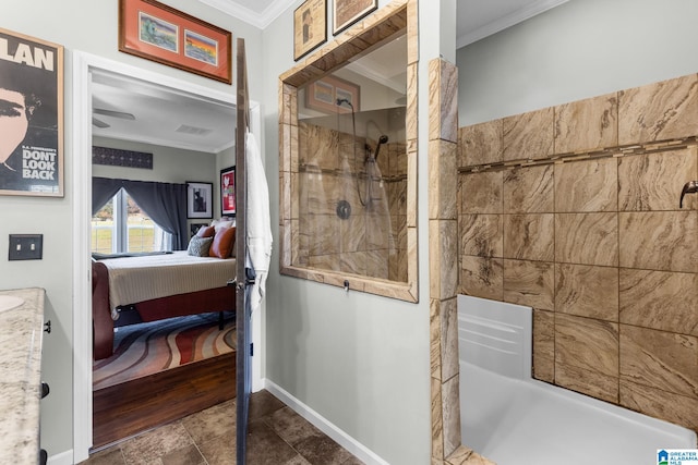 bathroom with a tile shower and crown molding