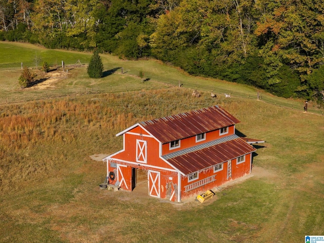 birds eye view of property with a rural view