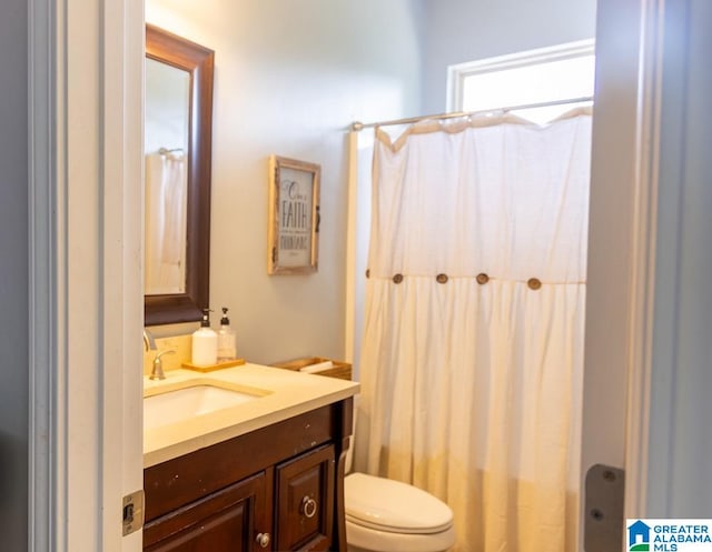 bathroom featuring vanity and toilet