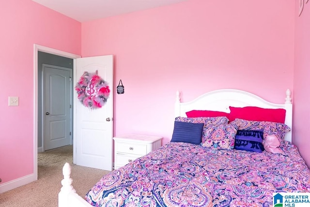 bedroom featuring light colored carpet