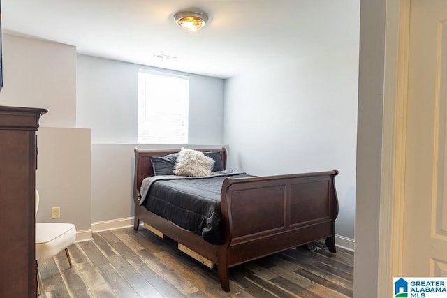 bedroom featuring dark wood-type flooring