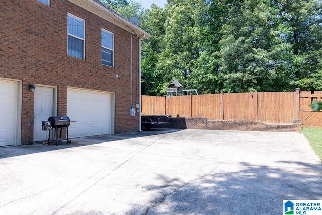 view of side of property with a garage